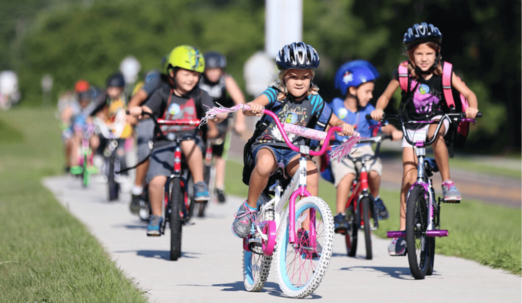 riding a bike to school with friends