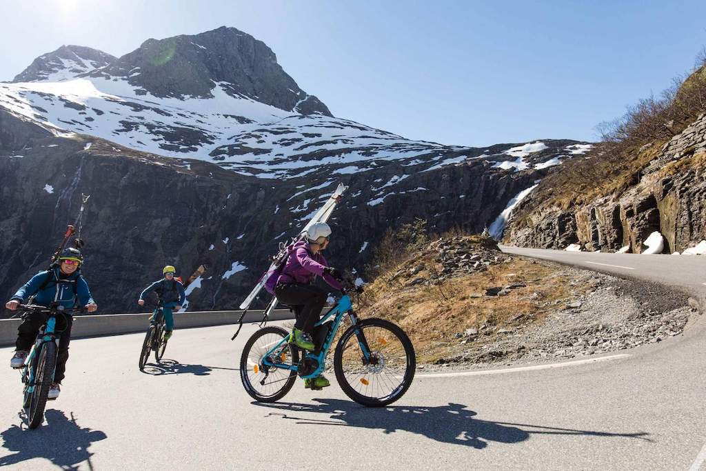 Cyclists riding up the Trollstigen Mountain Road in Norway