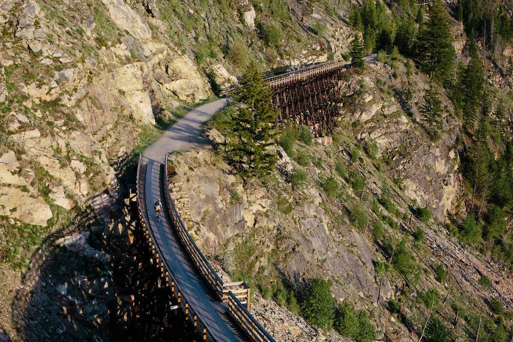 Cycling the Myra Canyon section of the Kettle Valley Railway near Kelowna, one of the best rail trails in Canada (photo: Destination BC/Grant Harder)