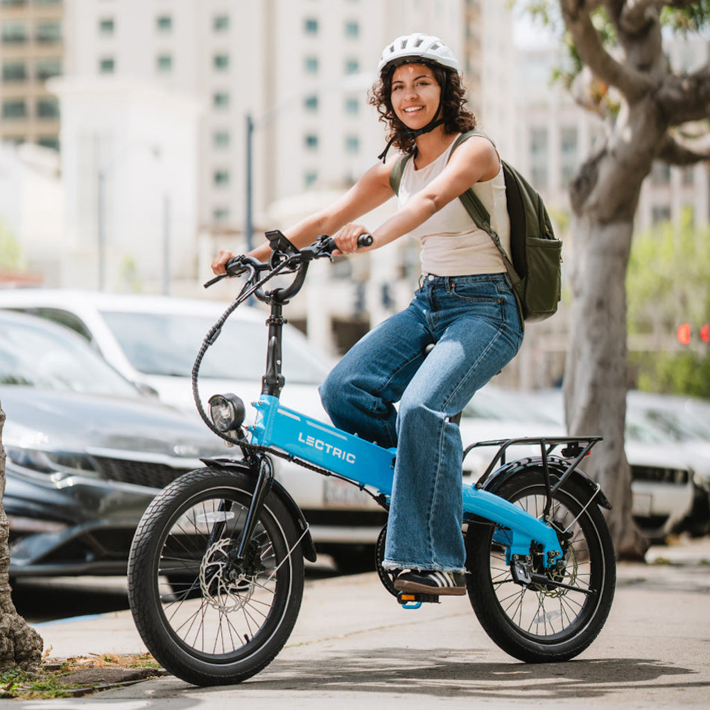 Lectric XP LIte 2.0 in blue with a woman riding