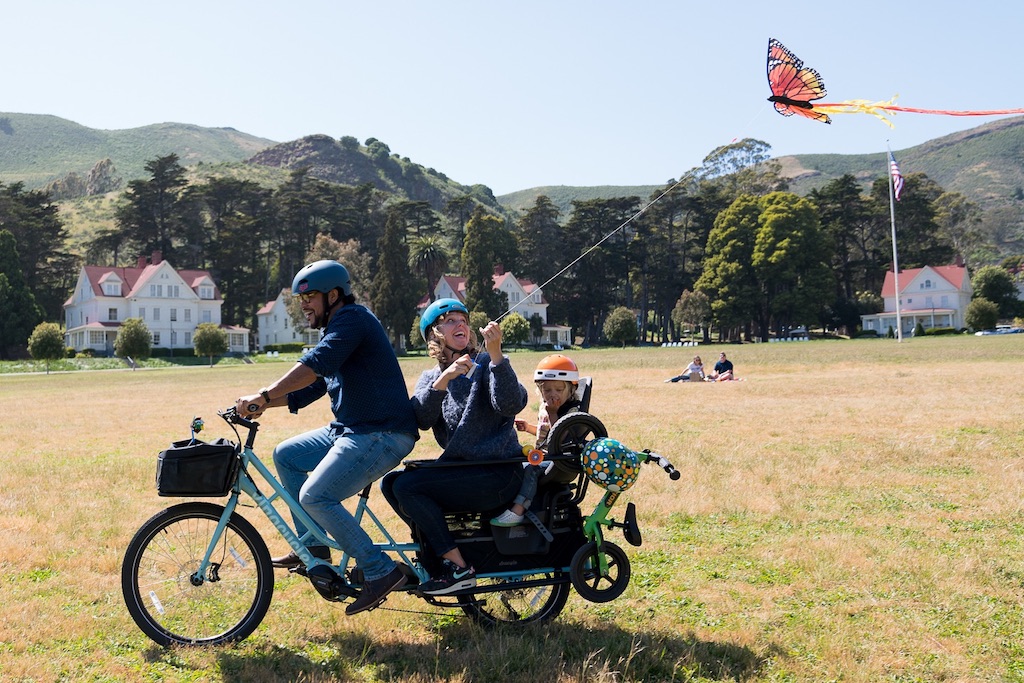 A family riding one Xtracycle cargo bike